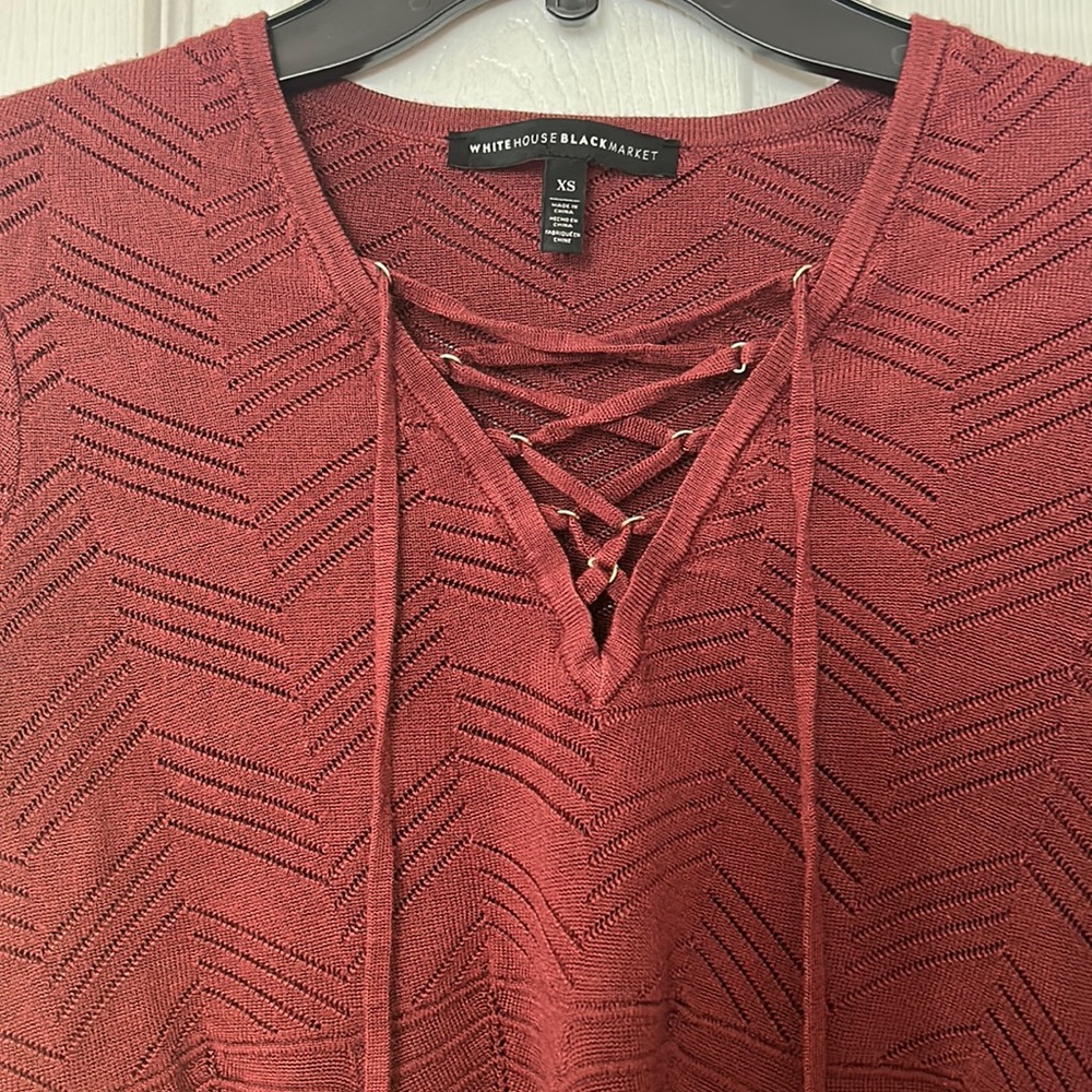 Long sleeve top with cross cross string across the chest